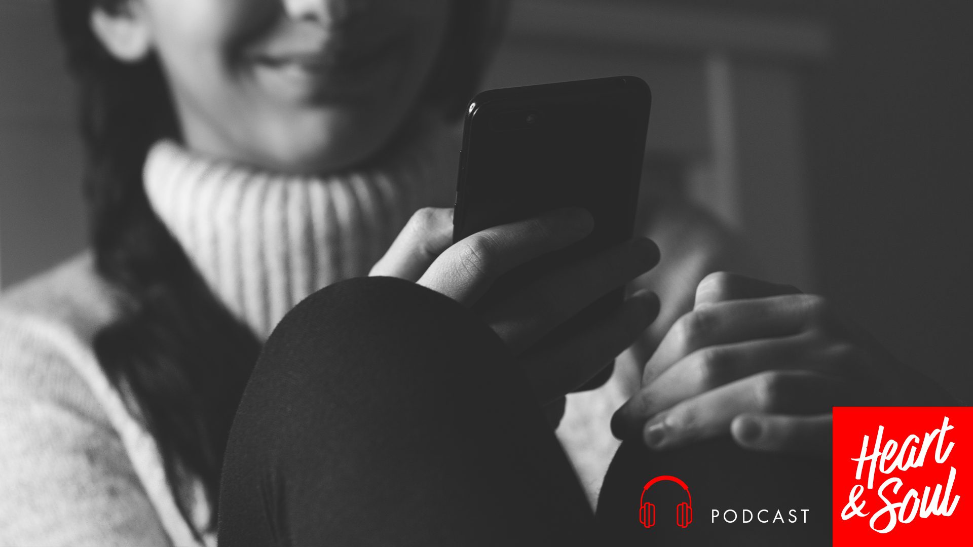 Girl smiling at phone
