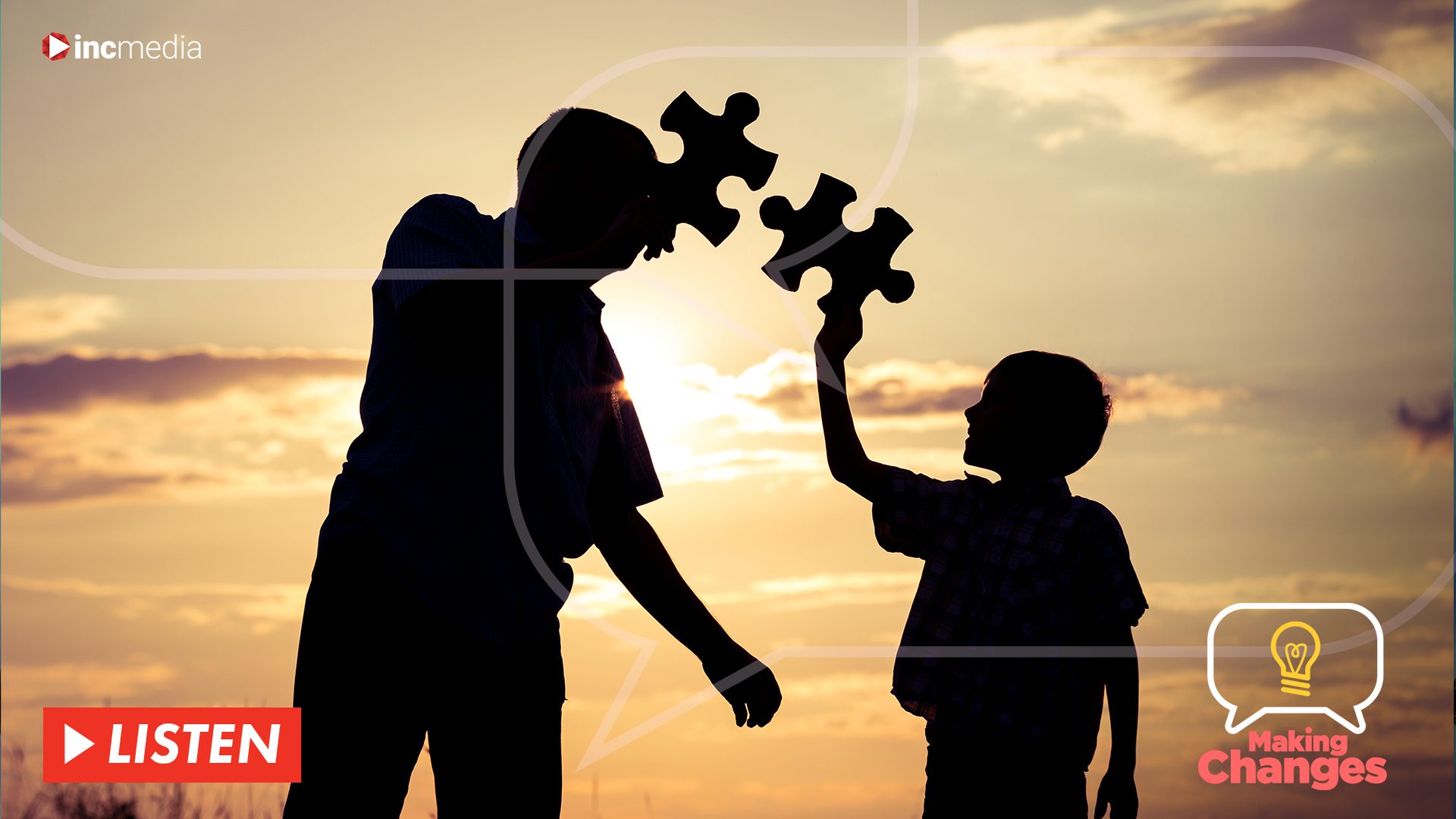 Silhouette of father and son each holding a puzzle piece