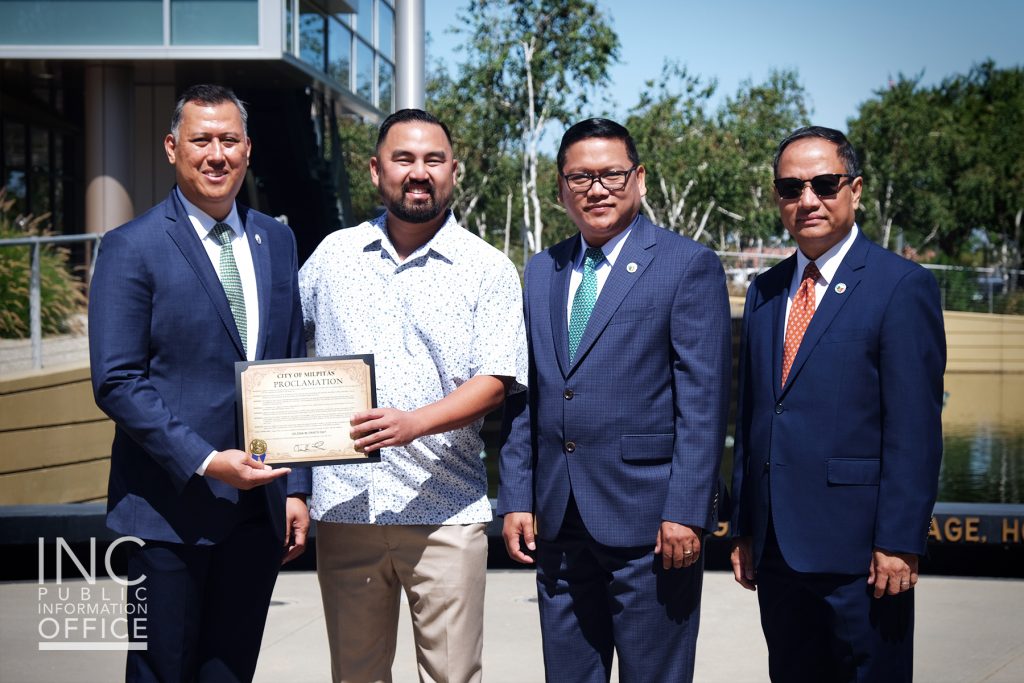 Four men stand together posing with a Certificate Recognition from Mayor of Milpitas, California, Rich Tran.